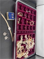 Costume jewelry in divided container