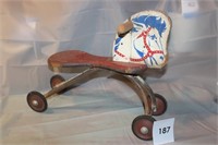 EARLY WOODEN RIDING HORSE W/ METAL BASE & WHEELS