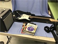 Lot with a Starcaster Fender electric guitar and a