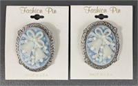 Two Oval Holiday Bell Cameo Brooches
