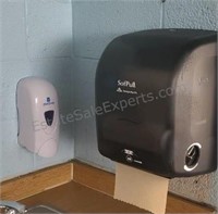 Soap and towel dispensers in room 103.