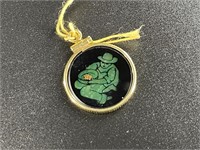 Small pendant with an jade scene depicting a gold