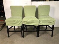 Set of 3 slipcovered high chairs.