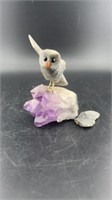 Owl sitting on amethyst stone (broken wing)