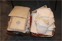 2 Boxes of linens - placemats, table cloths,