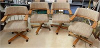 FOUR ROLLING DINING ROOM CHAIRS