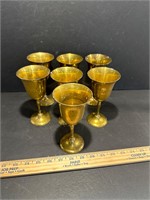 Seven brass chalices
