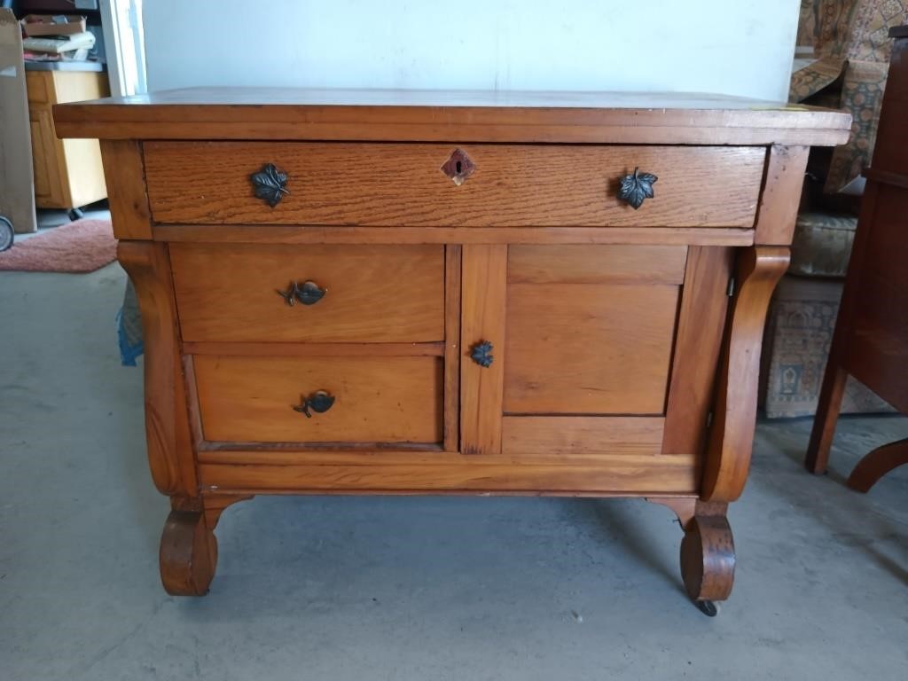 Oak / poplar three drawer one door cabinet on