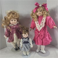 3 porcelain dolls w/ stands