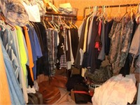 large walk in closet clothes of all kinds,