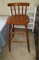 Wood stool with low back,