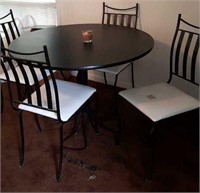 Round dining table with four chairs wrought iron