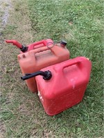 Three plastic gas cans