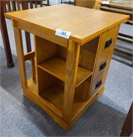 Rotating table with drawers and shelves