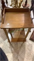 Small two level side table measures 26 inches