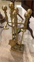 Brass fireplace tool set includes the stand, the