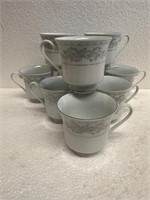 Vintage Porcelain Teacup Set of 9. No saucers.