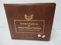 Golden replica of US stamps folder filled with