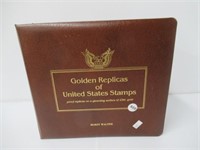 Stamp binder golden replicas of us stamps. Filled