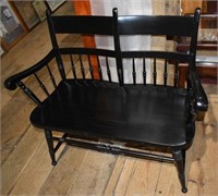 Windsor style black painted wooden deacon's bench,