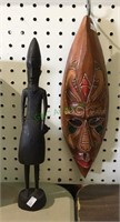 Lot includes a carved wooden African figure and a
