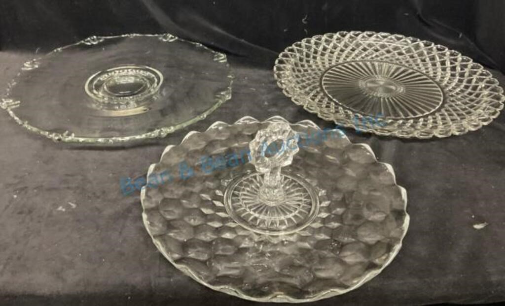 Three large glass serving trays