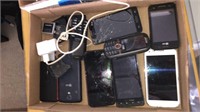 lot of broken cell phones