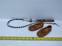 pair of child's moccasins and whip
