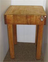 Wood butcher block table with Coca Cola bottle