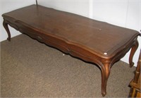 Wood coffee table with single drawer. Measures