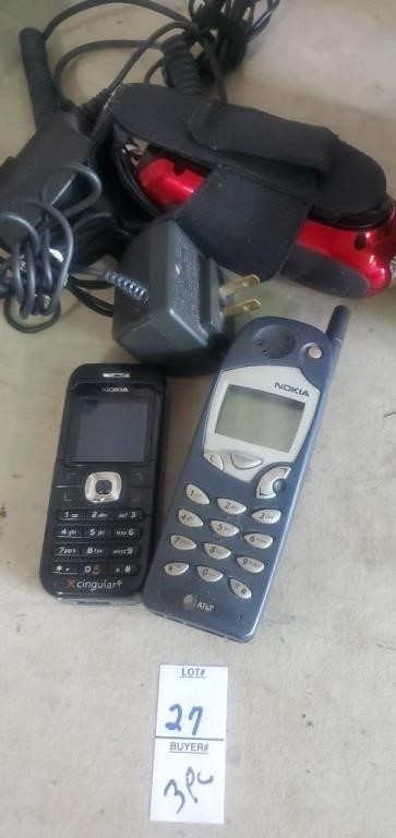 2 Nokia phones, chargers, and wind up flashlight.