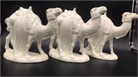 Three ceramic camels, lighted tree topper, small