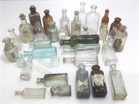 Assorted antique and vintage bottles and jars.