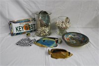Seashells, fish plaques, trivet, metal bowl,