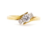 Three stone diamond set 18ct yellow gold ring