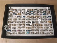 100 ASSORTED RINGS IN DISPLAY CASE