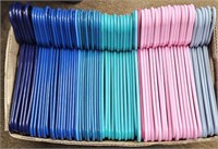 Box Full of Plastic Hangers Different Colors -