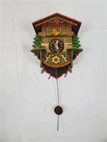 Beautiful vintage wooden clock with a bird that ro