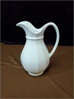 White pottery pitcher approx 9.5 inches tall