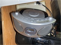 BOTTOM DRAWER OF CABINET INCLUDING AM FM RADIO, PO