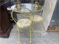 Metal glass top table and chairs ( no contents)