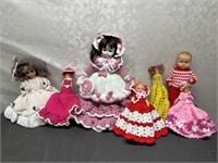 Assorted dolls with crocheted clothes
