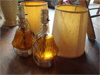 2  amber colored glass vanity lamps