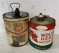 Phillips 66 and Wolf's Head 5 gallon oil cans