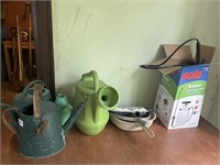 Dustpans, watering can, and pump sprayer