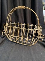 Oval metal basket. 17” x 10” and 14 inches tall