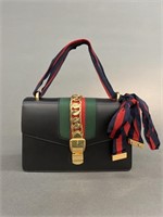 Gucci "Sylvie" handbag.