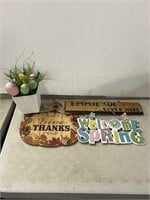 Assorted decorative signs and a small easter