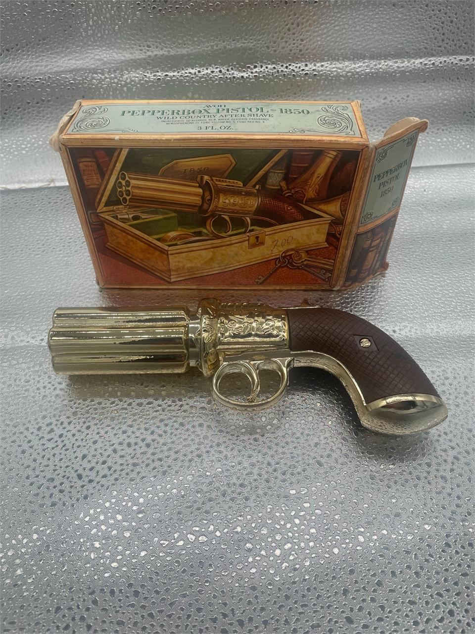 empty avon revolver aftershave with box