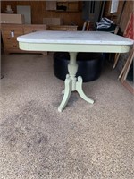 Square table painted green with white top